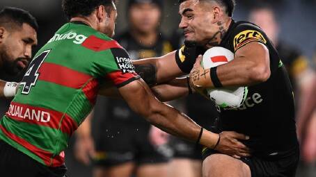 Taylan May (right) has been stood down by the Panthers after being arrested. (Dan Himbrechts/AAP PHOTOS)